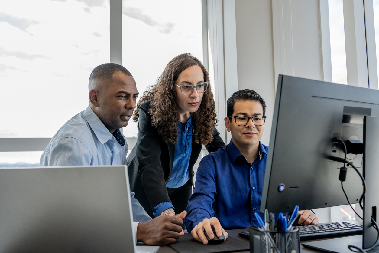 man working on it servers with laptop in hand
